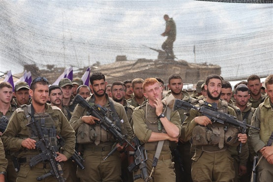 "IDF soldiers stand in formation while addressed by defence minister near Gaza"